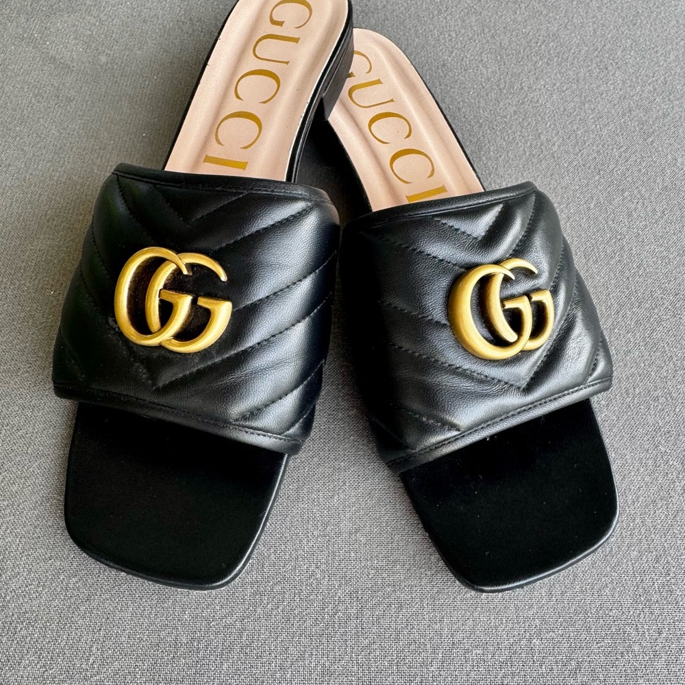 Gucci Quilted Black Sandals with Gold Emblem
